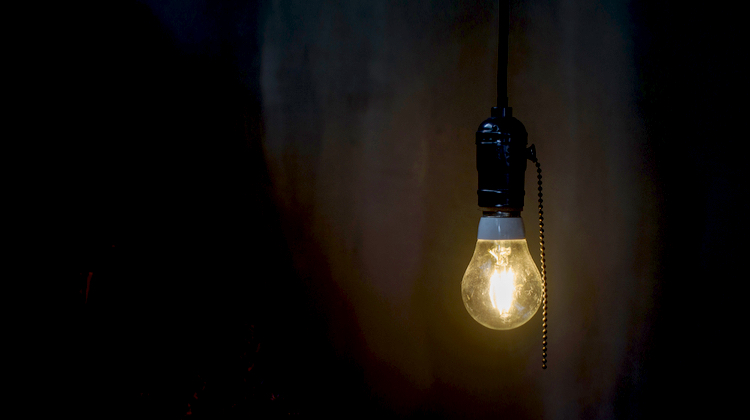 A single light bulb in a dark room