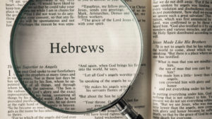Magnifying glass looking at the book of Hebrews