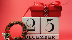 The date of December 25 with wrapped boxes and a wreath